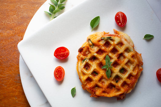 Golden brown stuffed pizza waffles made with Heavenly Waffles mix, filled with melted mozzarella, pizza sauce, and pepperoni.
