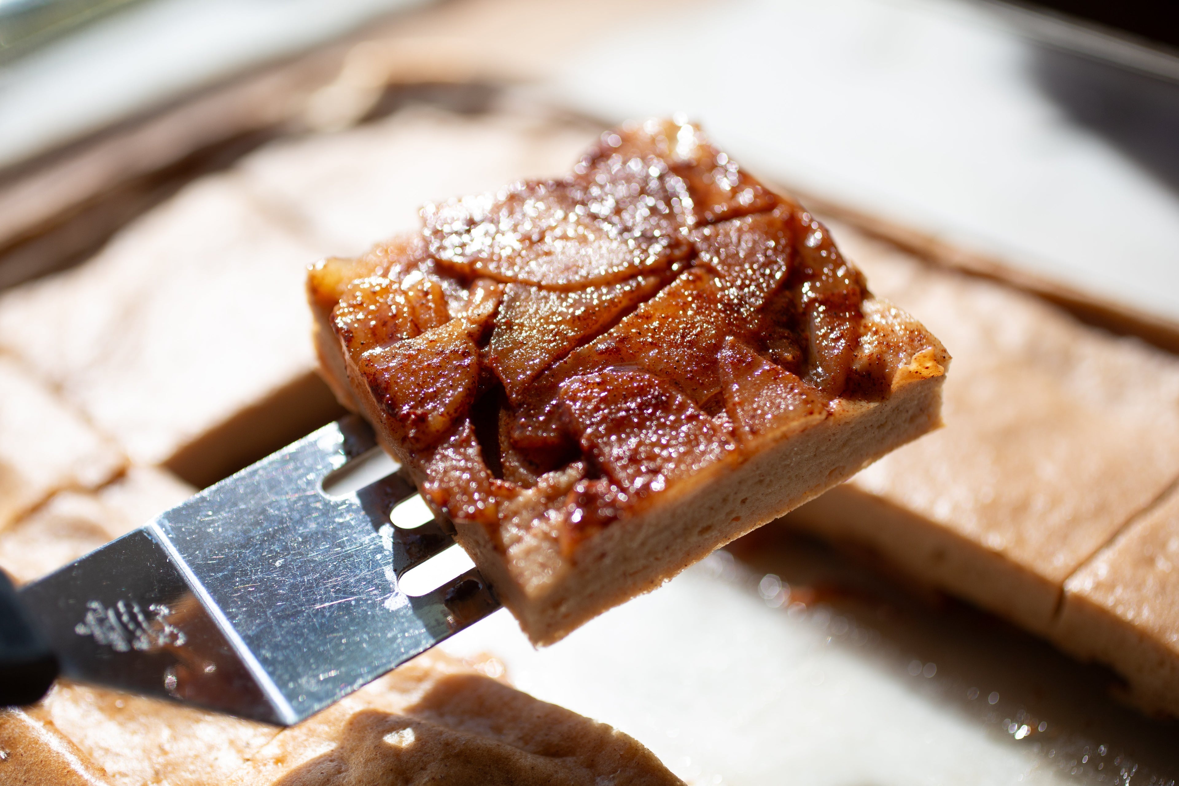 Golden baked apple cinnamon upside-down pancake, dusted with powdered sugar and topped with greek yogurt, whipped cream, or a little extra maple syrup. You can also substitute maple syrup for honey in this recipe!