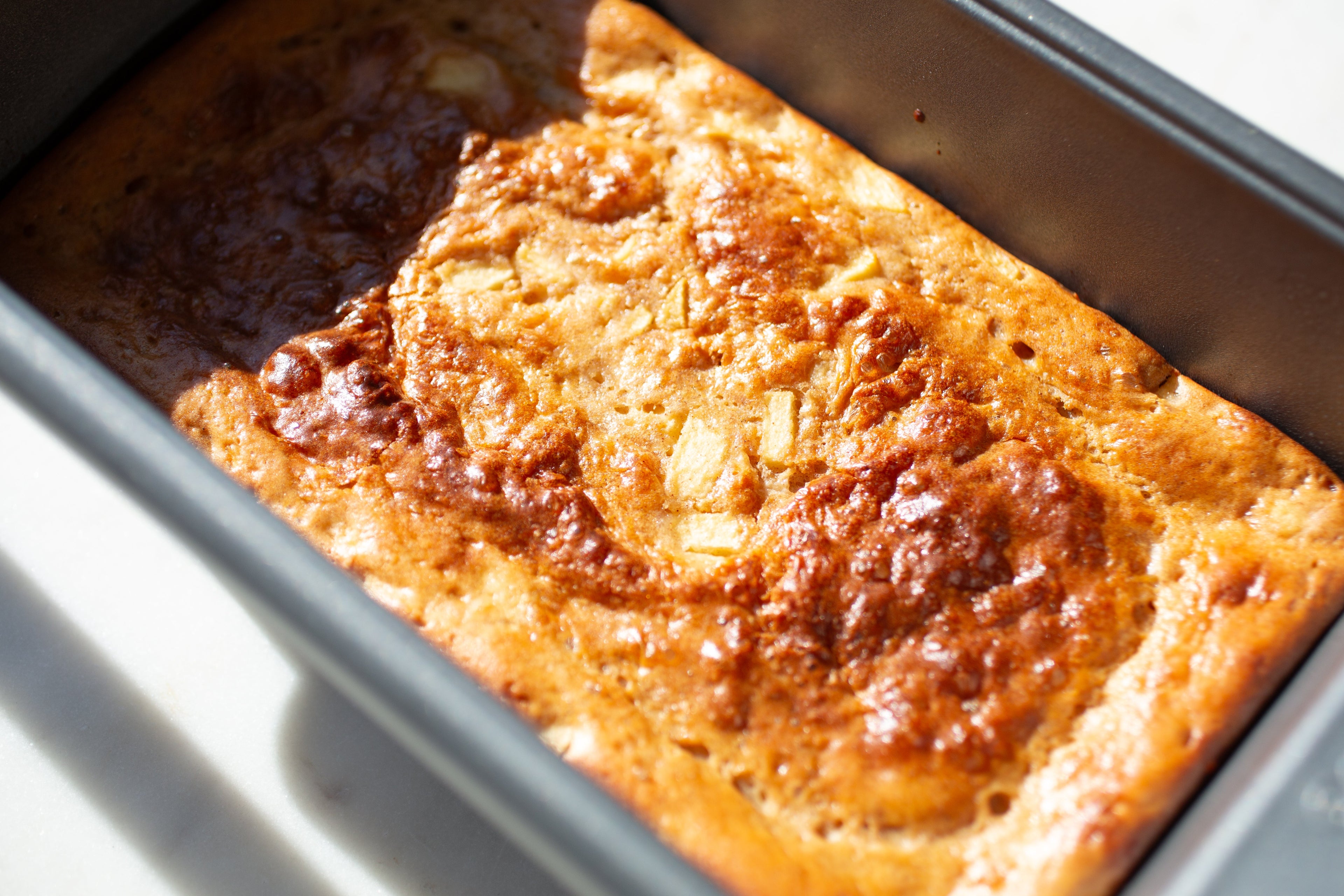 Cinnamon apple breakfast loaf sliced and served, made with Heavenly Foods mix